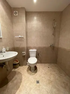 a bathroom with a toilet and a sink at Apartments in Panorama Beach Vigo Nessebar in Nesebar