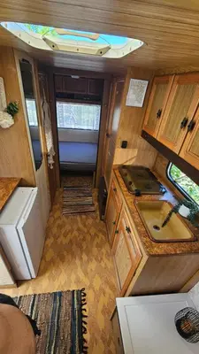 an interior view of an rv with a kitchen at Beachfront Caravans in Chernomorets