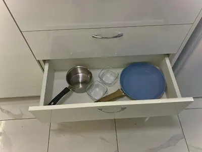 a white drawer with some pots and pans in it at AVRORA in Varna City