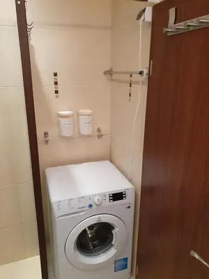 a washer and dryer in a small bathroom at Sea Star Sozopol in Sozopol