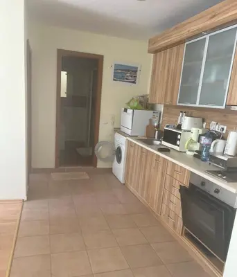 a kitchen with a sink and a counter top at Fort Noks - Marina View in Sveti Vlas