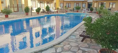 a swimming pool with blue water in a building at Апартамент в Oasis Beach Kamchia -THE FAVOURITE BLUE in Bliznatsi