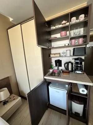 a small kitchen with a sink and a refrigerator at Sea View Private Studio Paradiso B 509 in Nesebar