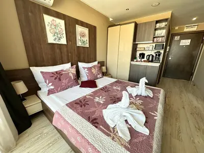 a bedroom with a bed with towels on it at Sea View Private Studio Paradiso B 509 in Nesebar
