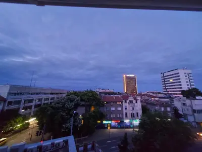 a view of a city at night with a building at Surf house in Burgas City