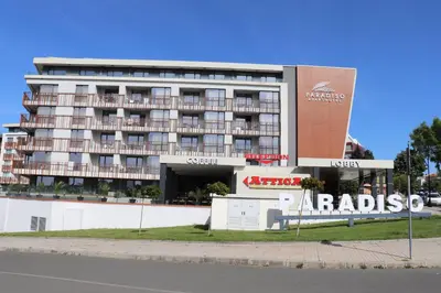 a large building with a parking lot in front of it at Sea View Private Studio B 511 in Nesebar