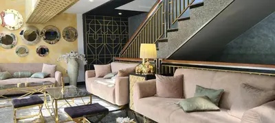 a living room with two couches and a staircase at Sea View Private Studio B 511 in Nesebar