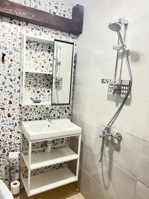 a bathroom with a sink and a shower at Мореплавателите / The seafarers in Sozopol