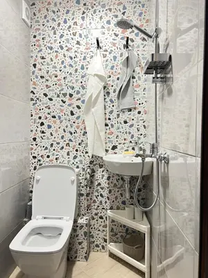 a bathroom with a toilet and a sink and a shower at Мореплавателите / The seafarers in Sozopol