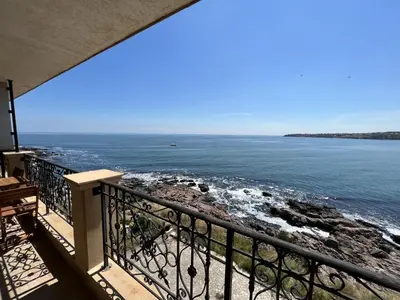 a view of the ocean from a balcony at Sea View 2BR Apartment Sozopol in Sozopol