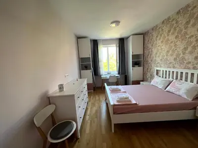 a small bedroom with a bed and a dresser at Sea Vibes - Modern Apartment Near the Beach & City Center, Burgas in Burgas City
