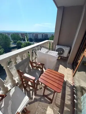 a balcony with a table and chairs on a balcony at Cascadas Family Resort in Sunny Beach