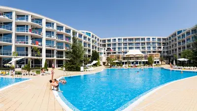 a large swimming pool with people in a resort at Design Studio in Atlantis Resort&SPA, Burgas Airport in Burgas City
