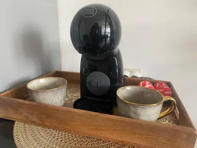 a coffee maker in a wooden tray with two cups at PARADISO 'В' 403 Fancy Studio Nessebar in Nesebar