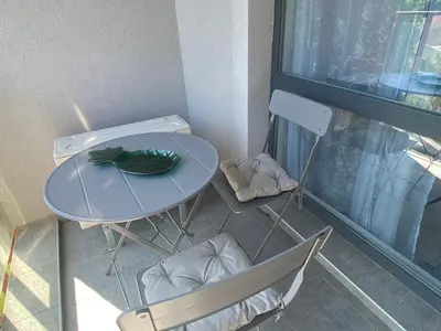 a table and chairs with a plant on top of it at PARADISO 'В' 403 Fancy Studio Nessebar in Nesebar