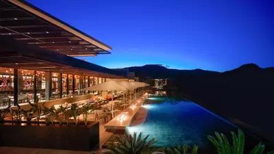 a hotel with a swimming pool at night at SIANA4 in Sveti Vlas