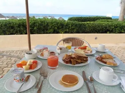 a table with plates of breakfast food on it at SIANA4 in Sveti Vlas