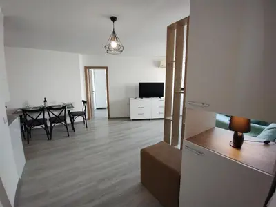 a living room with a table and a dining room at Apartament Sea Fort Club Grand Resort Fort Noks Sveti Vlas-Bastet BS in Elenite