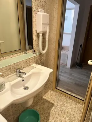 a bathroom with a sink and a shower at AVALON, Apartment C102 in Sunny Beach