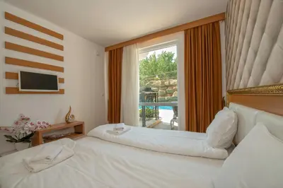 a bedroom with a bed and a large window at Sweet Homes 2 Holiday Apartment in Sunny Beach