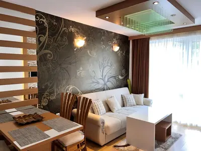 a living room with a couch and a table at Sweet Homes 2 Holiday Apartment in Sunny Beach
