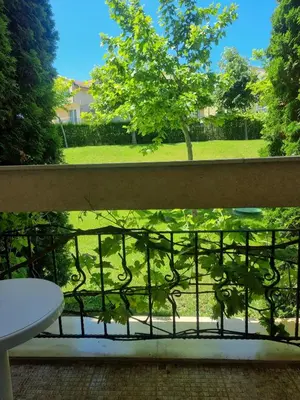 a view of a garden from a balcony at Prestige Fort Beach apartment, Studio in Sveti Vlas