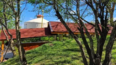 a house with a red roof and a white dome at Gala park fpv in Avren