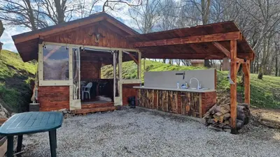 a wooden cabin with a sink and a counter at Gala park fpv in Avren