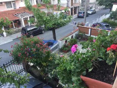 a view of a street with flowers in a garden at Violeta 7 Guest House in Nesebar
