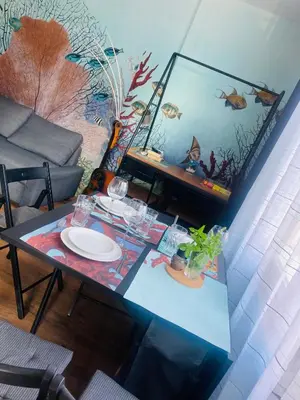 a living room with a table and a couch at Desis Seaside Hideaway in Pomorie