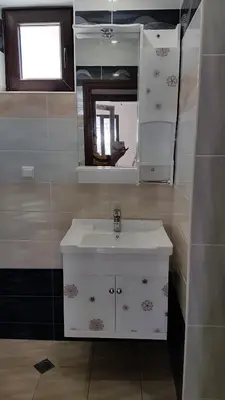a bathroom with a sink and a mirror at Luxury Apartments Ekaterina in Chernomorets
