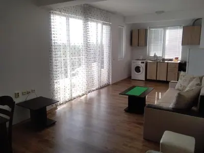 a living room with a couch and a table at Апартаменты за гости Гаван in Byala