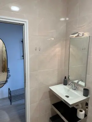 a bathroom with a sink and a mirror at Ив-Бо in Ravda