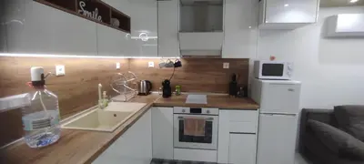 a small kitchen with a sink and a counter top at Apartment Krisiya in Burgas in Burgas City