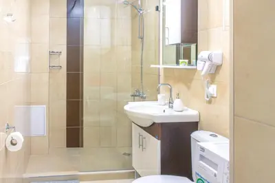 a bathroom with a toilet and a sink and a shower at Central location and FREE parking in Varna City