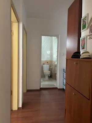 a hallway with a bathroom with a toilet in it at Sunny apartment in Sunny Beach in Sunny Beach