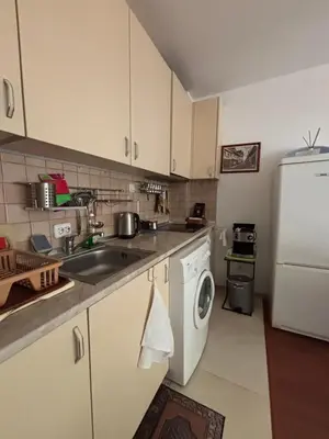 a kitchen with a sink and a white refrigerator at Sunny apartment in Sunny Beach in Sunny Beach