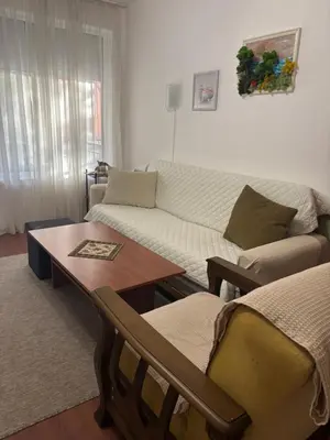 a living room with a couch and a table at Sunny apartment in Sunny Beach in Sunny Beach