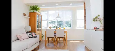 a living room with a couch and a table with chairs at Central DELUXE Apartment in Burgas City