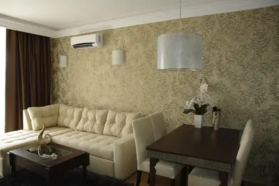 a living room with a couch and a table at Harmony Palace in Sunny Beach