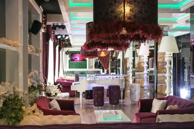 a lobby with couches and a table in a building at Harmony Palace in Sunny Beach