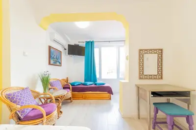 a living room with a table and chairs at Casa Del Mare in Chernomorets