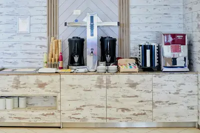 a wooden cabinet with appliances on top of it at Sentido Bellevue Beach- All Inclusive & Beach Access in Sunny Beach