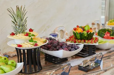 a buffet with several bowls of fruit on a table at Sentido Bellevue Beach- All Inclusive & Beach Access in Sunny Beach