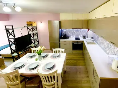 a kitchen with a table and chairs in a kitchen at Top Location !!FREE parking!! 