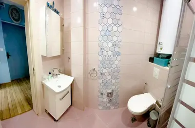a bathroom with a toilet and a sink at Top Location !!FREE parking!! 