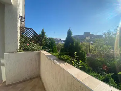 a balcony with a view of a garden at FREGATA 2 Studio Sveti Vlas in Sveti Vlas