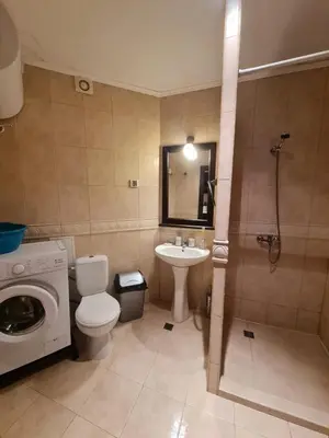 a bathroom with a toilet and a sink and a shower at Apartment Almi - The Cliff Obzor in Obzor