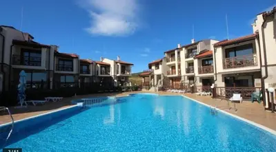 a large swimming pool in front of some apartments at Dream Villa in Imperial Heights Villas in Sunny Beach