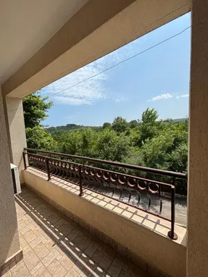 a balcony with a view of the trees at Galeria Holiday Apartments in Obzor
